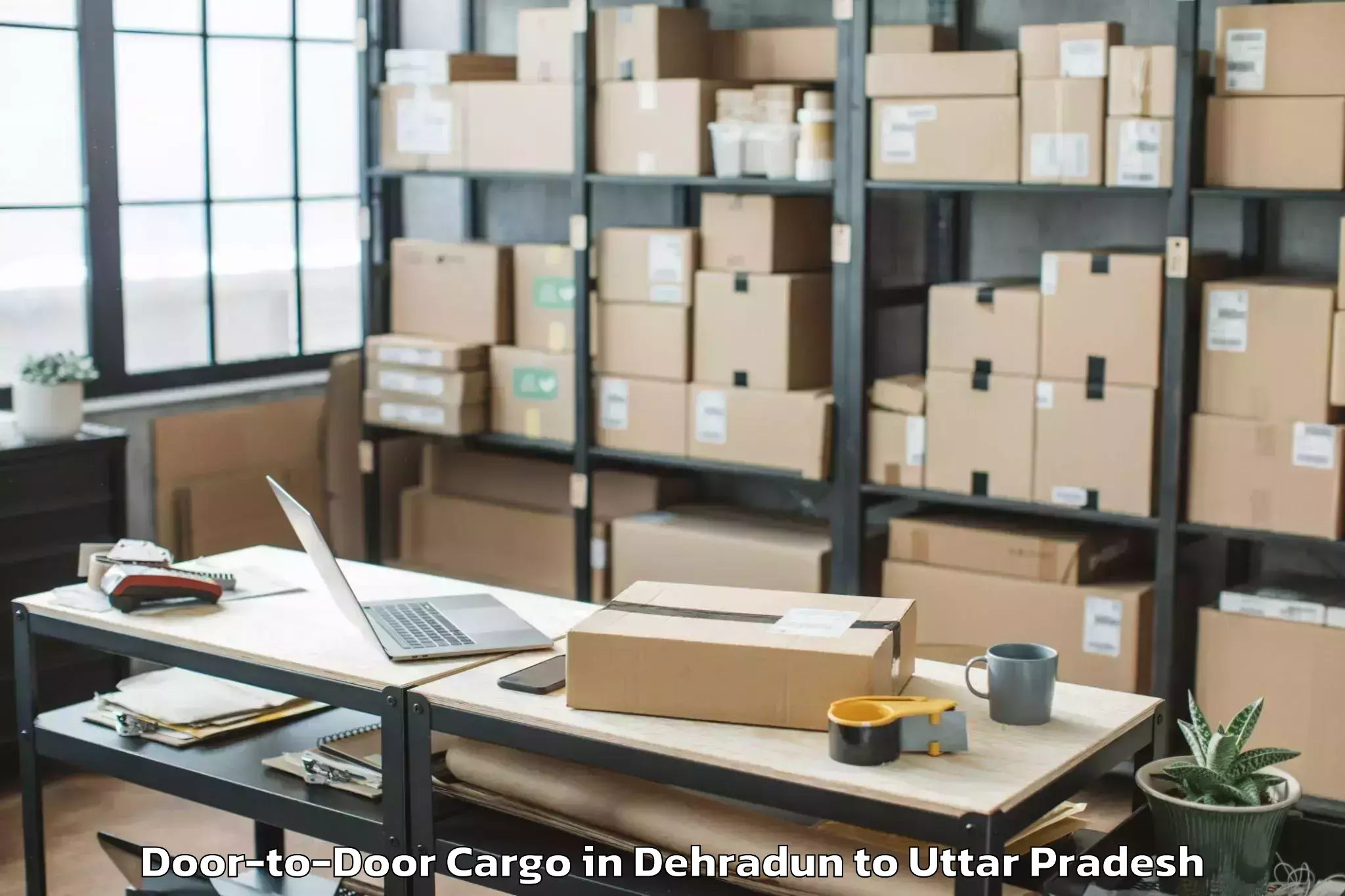 Reliable Dehradun to Manjhanpur Door To Door Cargo